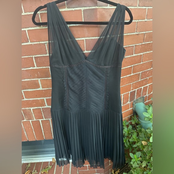 Adorable little black dress with swing. - Picture 1 of 3